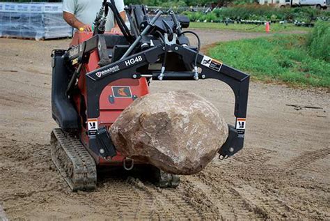 Moving landscape rocks with the mini skid steer 